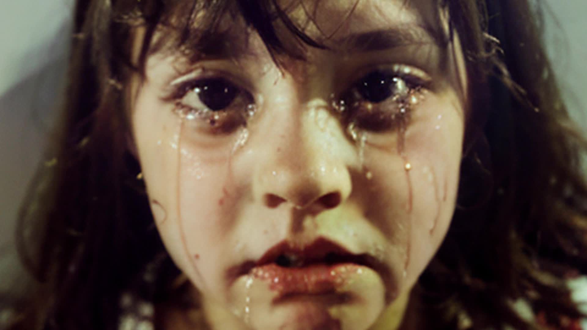 crying little brunette girl