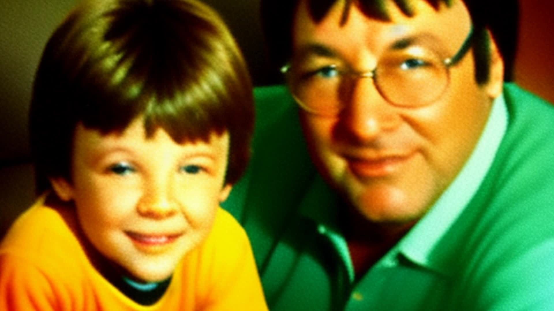 happy father and son sitting on the couch