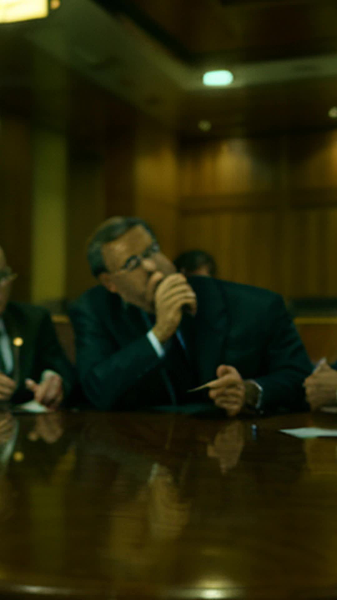 Federal Reserve officials strategizing interventions, close up, intense focus in a dimly lit, wood-paneled meeting room