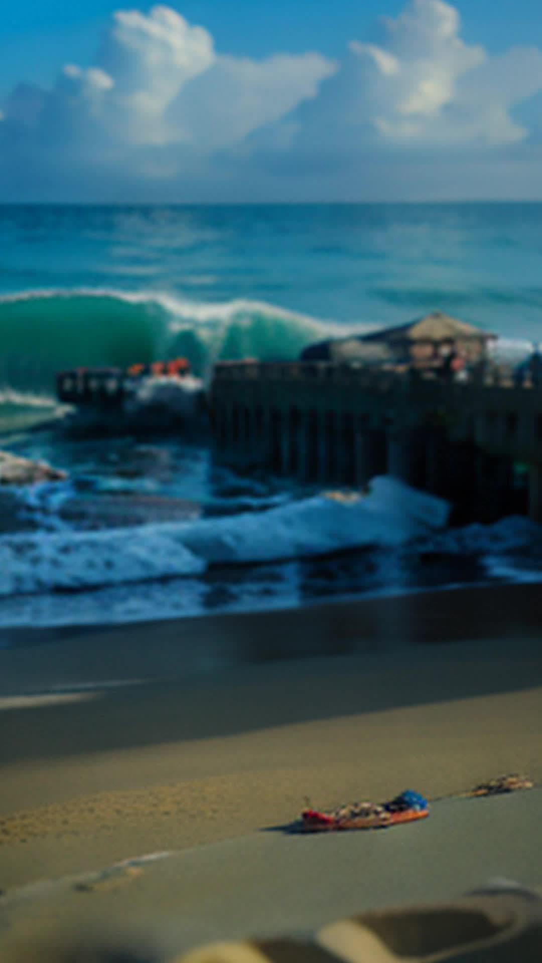 Audience captivated by untold beach stories, intense listening, close up, serene beach waves in background with remnants of old piers and artifacts