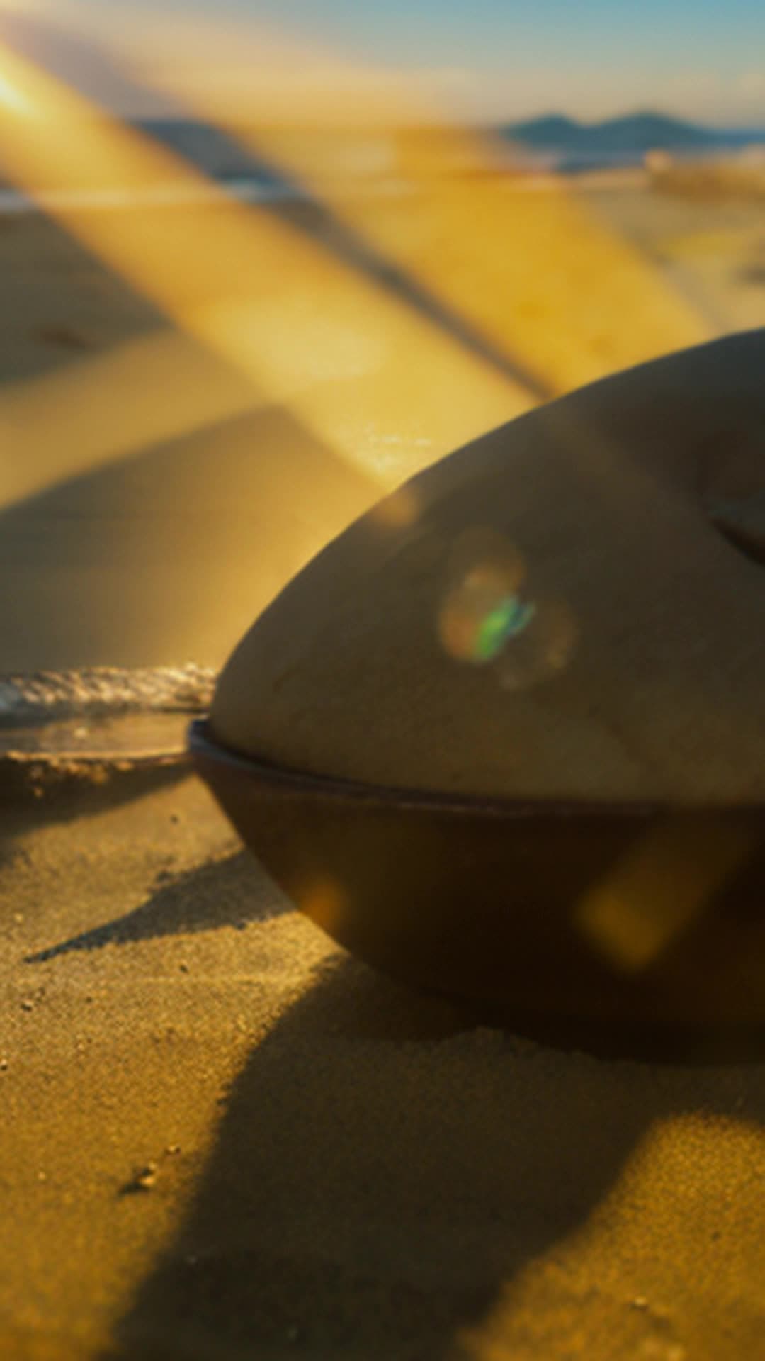 Golden hour beach photos, warm tones, long shadows, social media engagement, ethereal quality, sunrise, sunset, capturing images, wide angle, serene beach setting with soft sunlight