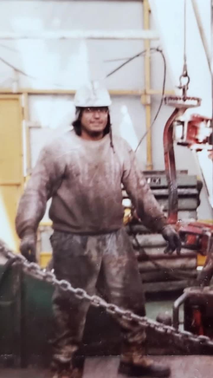 Hardworking father with sweat glistening on brow grinning broadly sways head joyfully to heavy rock guitar solo as vibrant pyrotechnic explosions burst brilliantly illuminating distant mountainous horizon dynamic lasers dance through night sky electrifying atmosphere expands around him overseeing vast intricate construction miniature landscape of rugged rocky mountains rising majestically from Earth endless details captured in sweeping panoramic view surrounded by shadows and flickering lights adding intensity to the scene