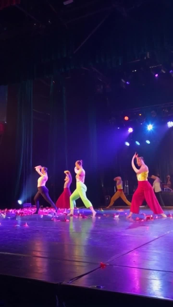 Graceful figures twirling in vibrant costumes  Spinning swirling leaping across a sunlit stage  Colorful streamers fluttering through a sparkling atmosphere