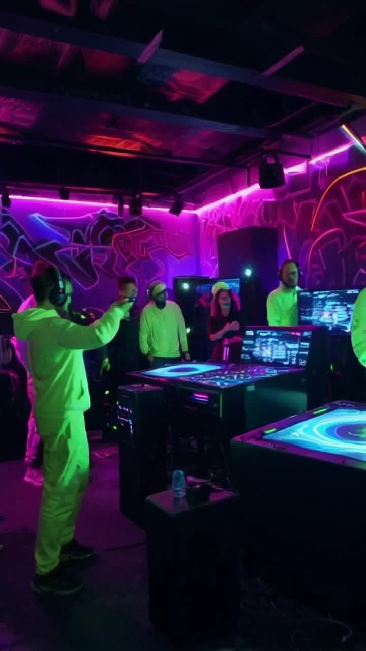 Vibrant diverse collective of rebels adorned in neon attire passionately gather in immersive underground VR hubs pulsating with virtual energy. Skilled hackers rapidly concoct chaotic digital visuals manipulating Syndicate surveillance feeds igniting a sonic revolution. Electric neon graffiti illuminates dim concrete walls creating a mesmerizing backdrop as sound waves reverberate through the immersive virtual space. Futuristic cityscape outside framed by glowing skyscrapers and flickering billboards vibrates with rebellion's rhythm as distant sirens blur into harmonious chaos echoing through neon-lit streets