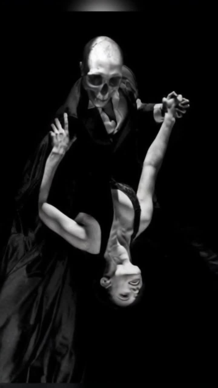 A beautiful woman, dressed in a elegant tight black dress that moves and flows beautifully, dances with death, a skeleton dressed in a slick black suit, they twirl together and he dips her back passionately as she leans, a black and white checkered tile ballroom floor beneath them, the background is a gorgeous night sky with galaxies and stars lighting up the sky, 