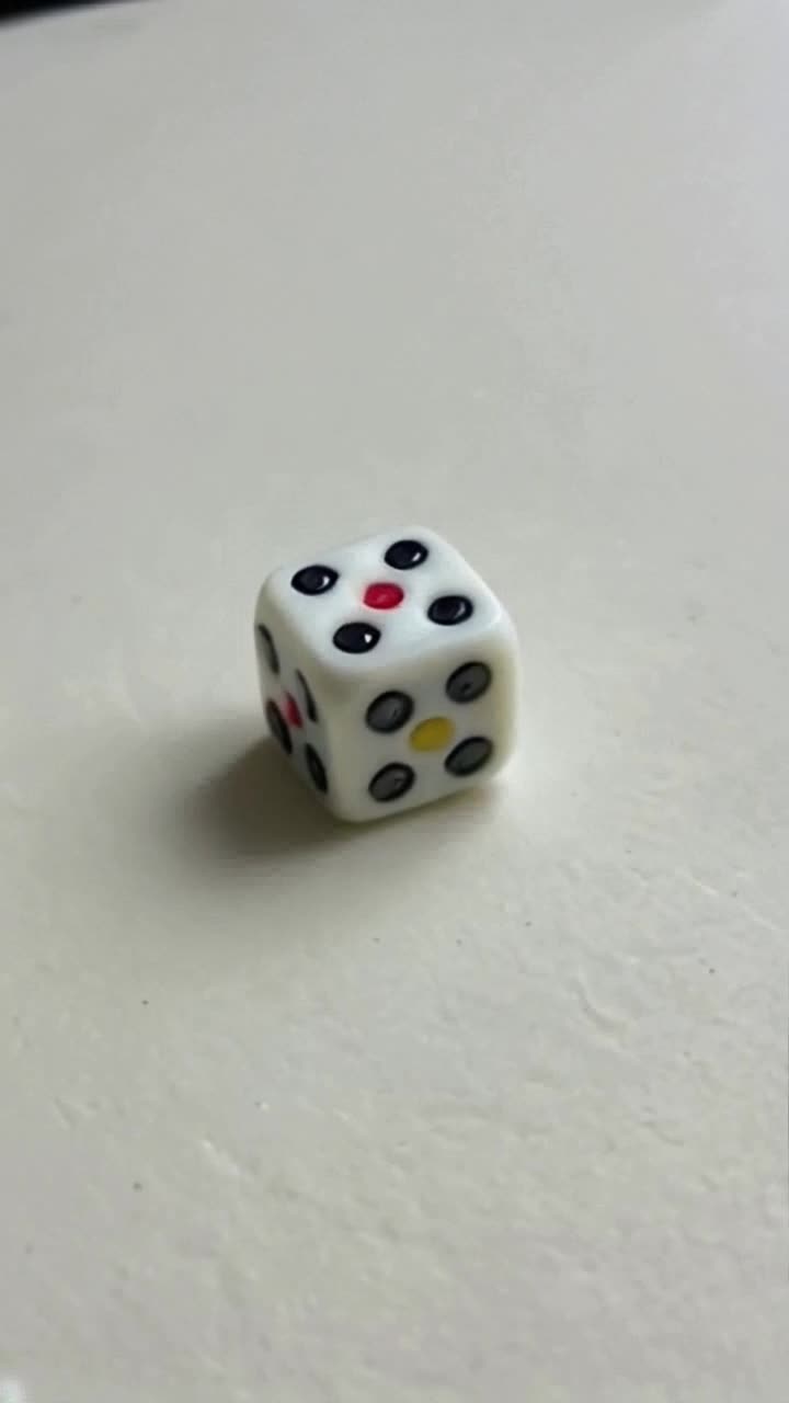 a dice rolling on a table