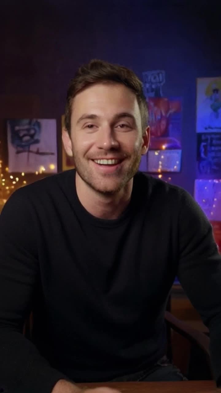 Charismatic thirtyyearold man sharing captivating stories Enthusiastically engaging with viewers in a vibrant home studio Surrounded by colorful posters and twinkling fairy lights