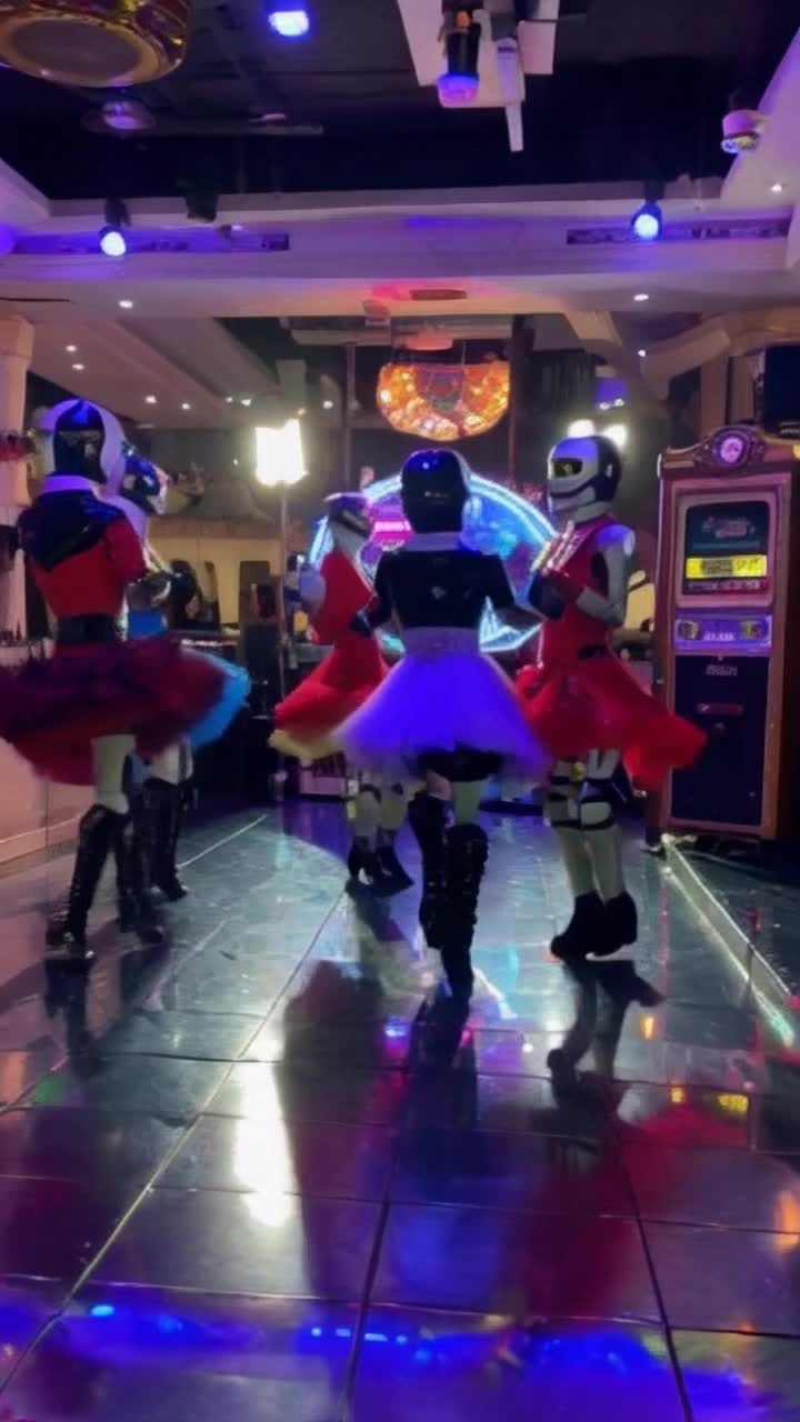 Charming robots twirling joyfully in vibrant rockabilly glam dresses reflecting playful 1950s spirit gliding effortlessly across a shiny chrome dance floor sparkling under colorful disco lights casting a nostalgic glow vintage jukebox softly playing retro tunes creating an atmosphere of excitement and whimsy
