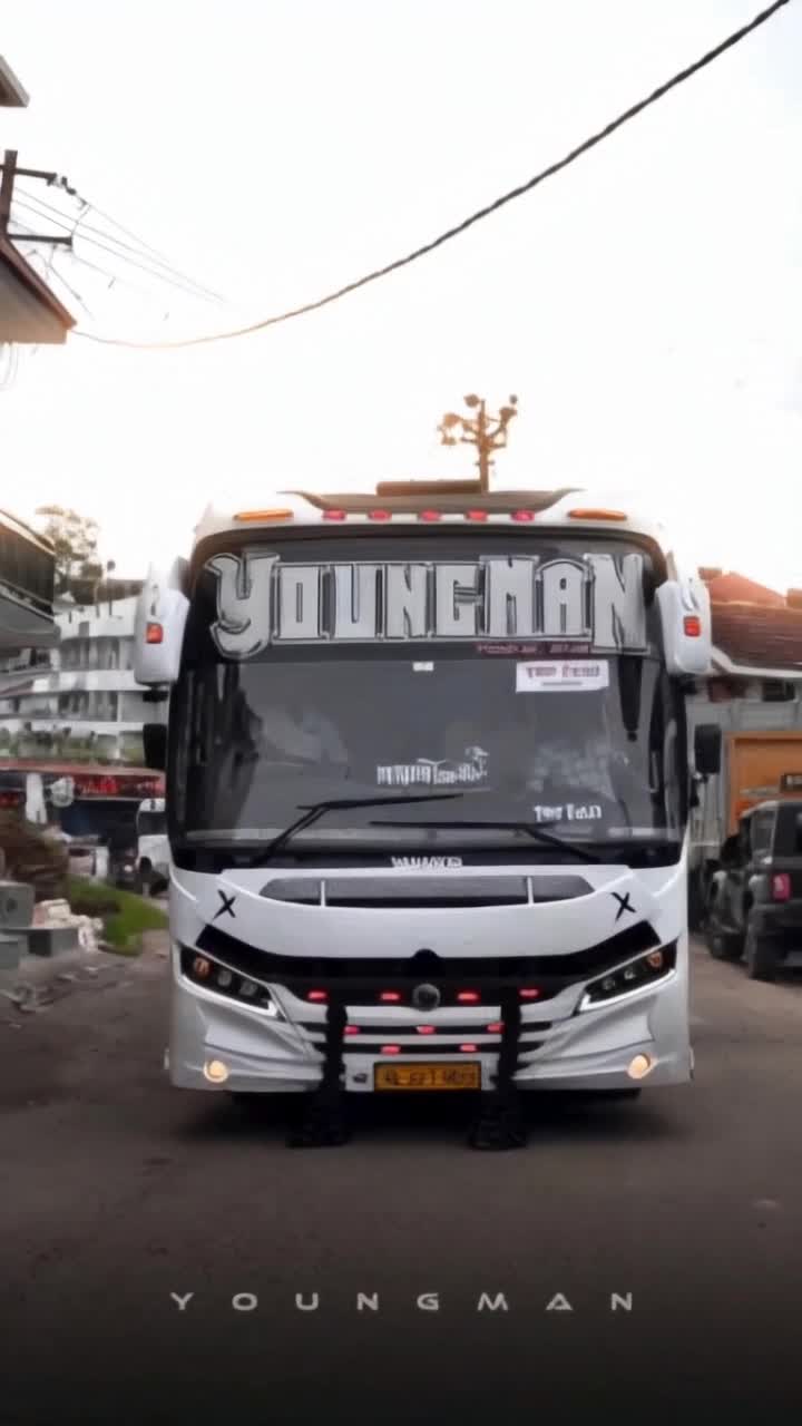 the bus suspension raises and monster wheels pop out from under the bus flying and jumping 