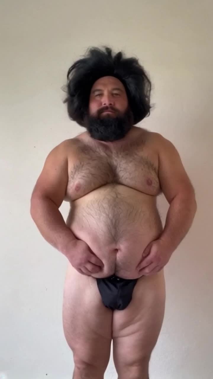 Fat man tattoos shritless backside wiggle 