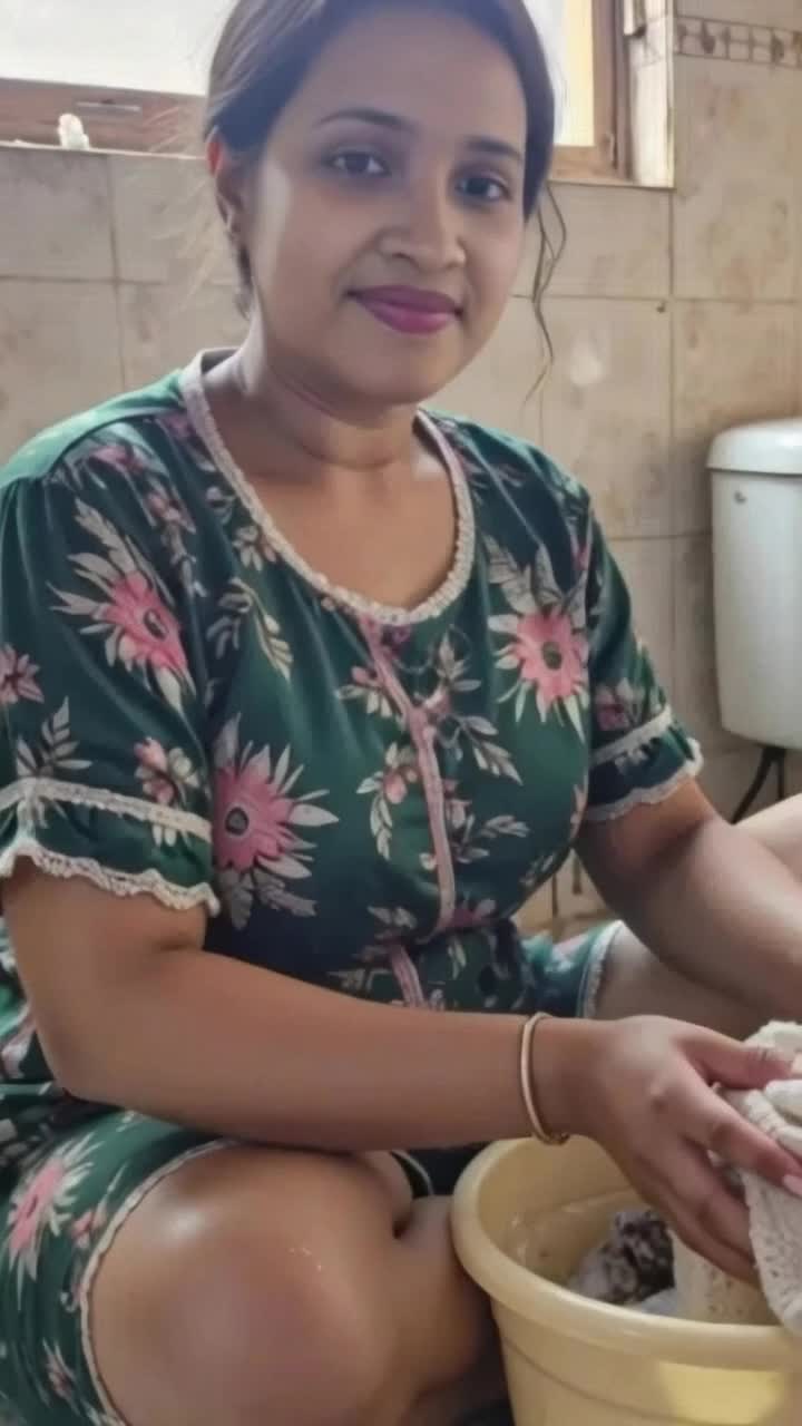 Washing cloths, while her 