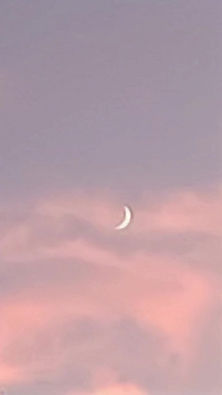 show the moon in the sky and , its over hills and a valley below and you are moving towards the moon over the hills