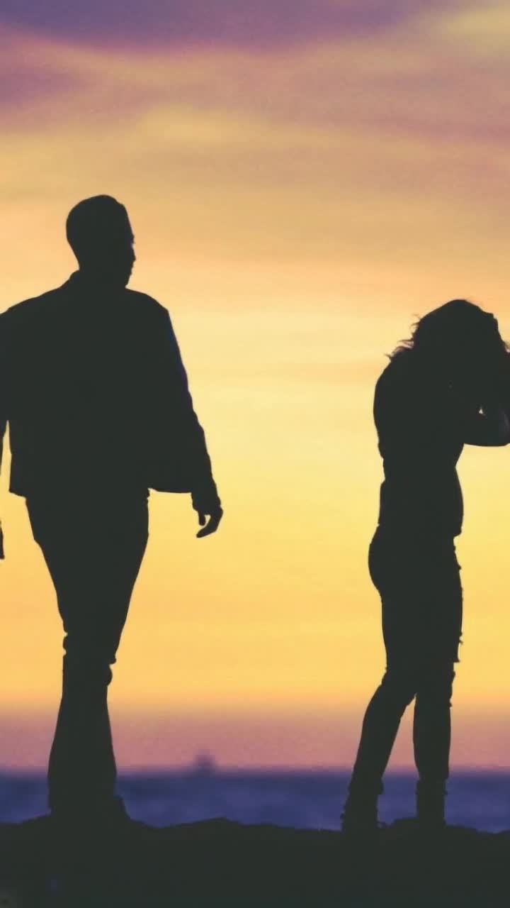 man walking towards woman