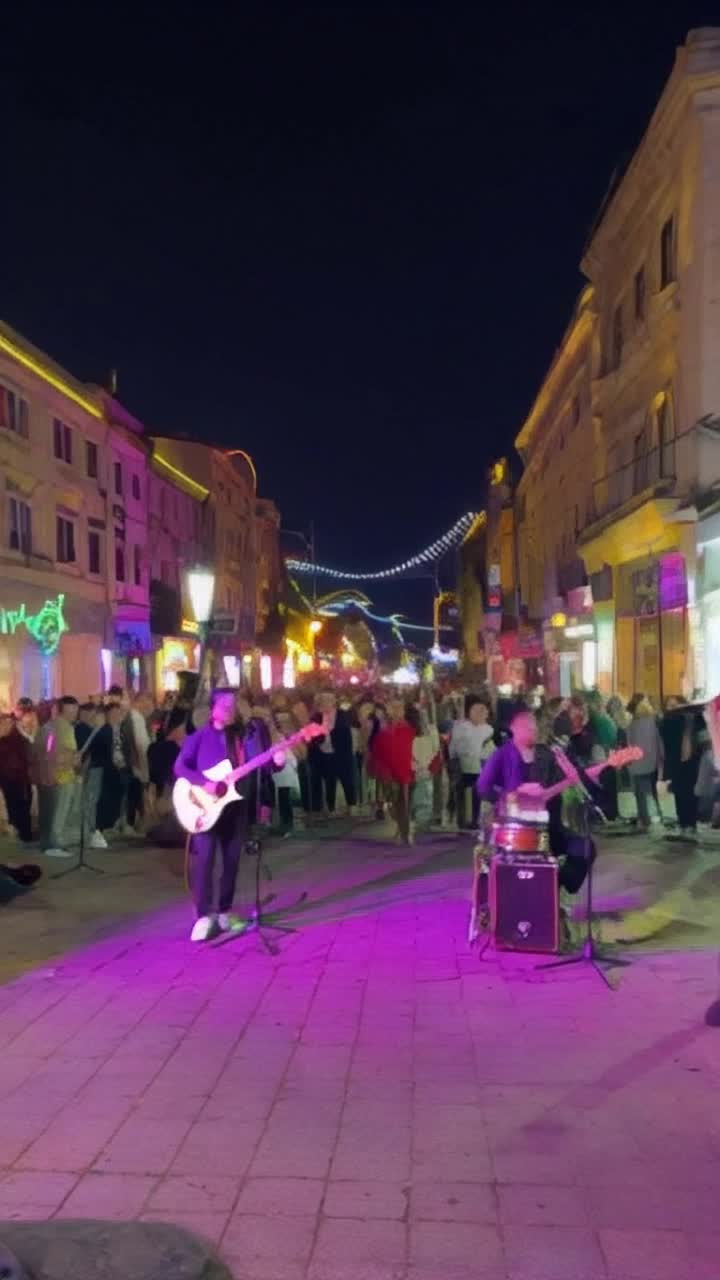 colorful band of musicians playing lively instruments harmoniously creating enchanting melodies vibrant urban street filled with enthusiastic dancers animated neon lights flashing rhythmically bright graffiti art splashed on walls capturing high energy essence of the performance