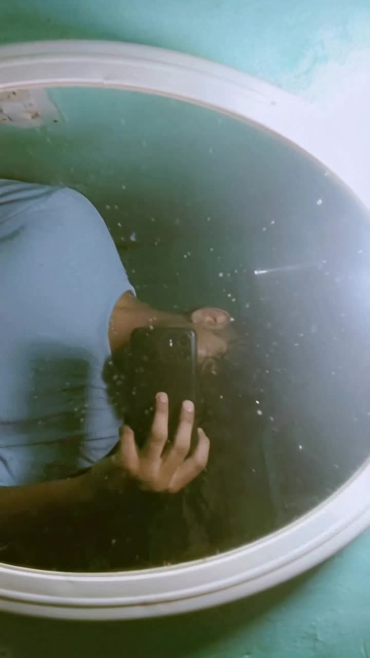 Slowly water is flowing only on mirror and   everything is still