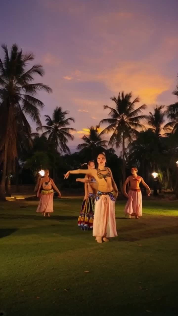 Vibrant dancers adorned in flowing traditional costumes swirl amidst a kaleidoscope of colors Energetic footwork echoes ancient rhythms as they perform mesmerizing tandav movements, embodying fierce emotions and divine passion The scene is alive with dynamic expressions and powerful gestures Lush, verdant surroundings bloom in the backdrop, accented by swaying palm trees under a twilight sky painted in shades of orange and purple Flickering lanterns cast a warm glow, illuminating the performers intricate jewelry and makeup, creating an enchanting atmosphere where culture and history intertwine in a breathtaking celebration of movement and artistry