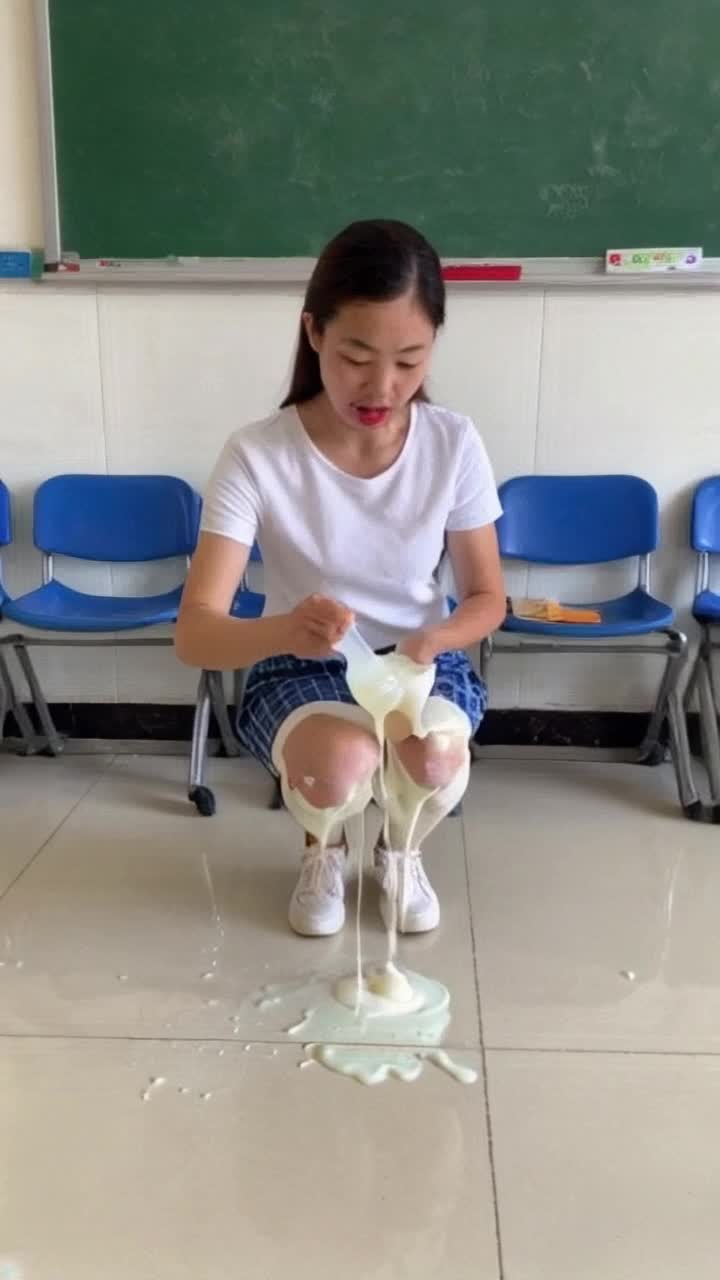 Grade school teacher has been teaching about Hungary and is oozing white liquid from underneath her miniskirt and now she cant stop it from oozing and shes crouching down and the liquid is spraying out from underneath her skirt and across the classroom 