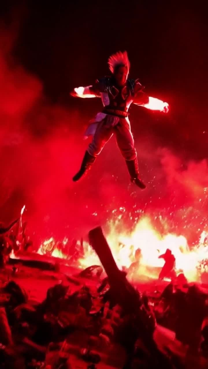 Fierce warrior with spiky hair radiating vibrant energy  
Soars high above chaotic battle executing powerful punches and spinning kicks  
Red gel lighting casts dramatic shadows on swirling dust clouds and clashing weapons