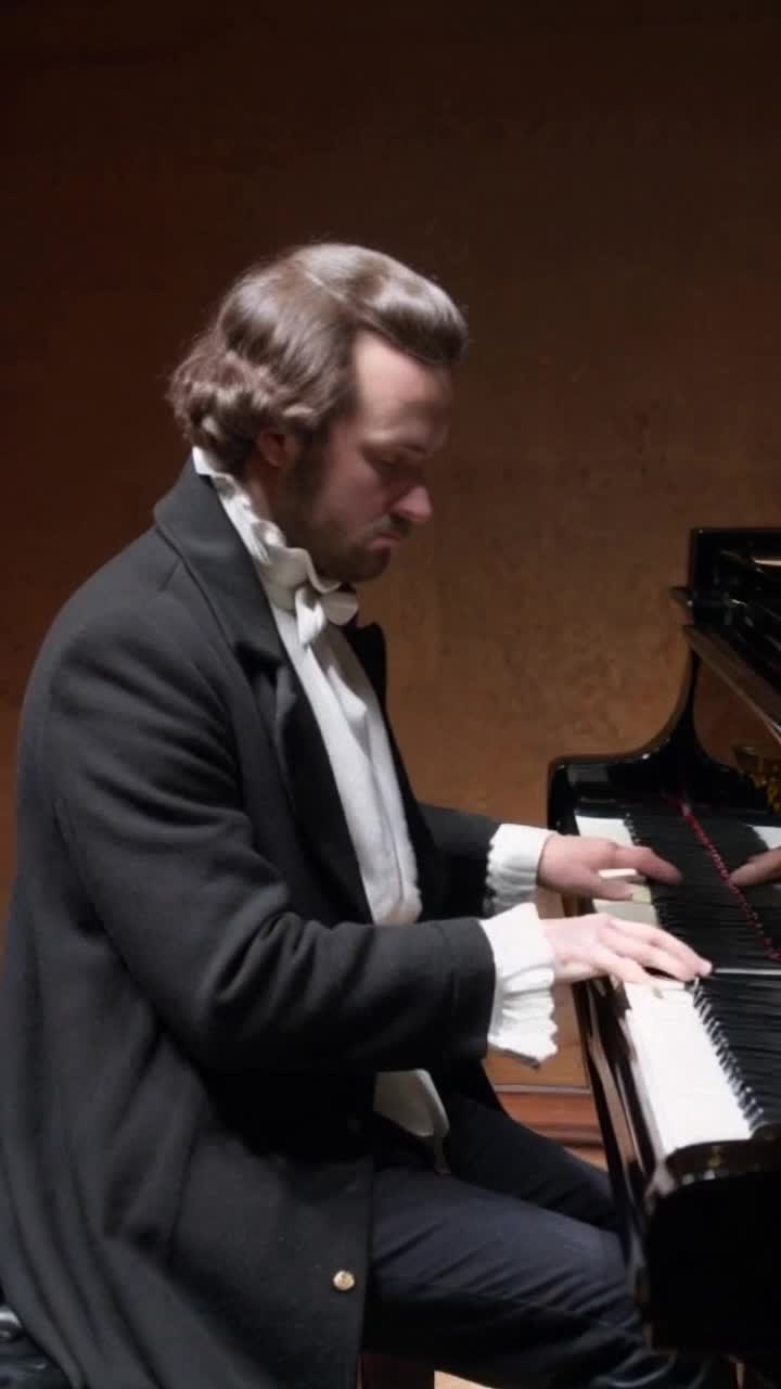 A photo realistic historically accurate RAW video of Mozart at the piano Mozart is dressed in historically correct period costume but has prominent vampire teeth and black faeries wings