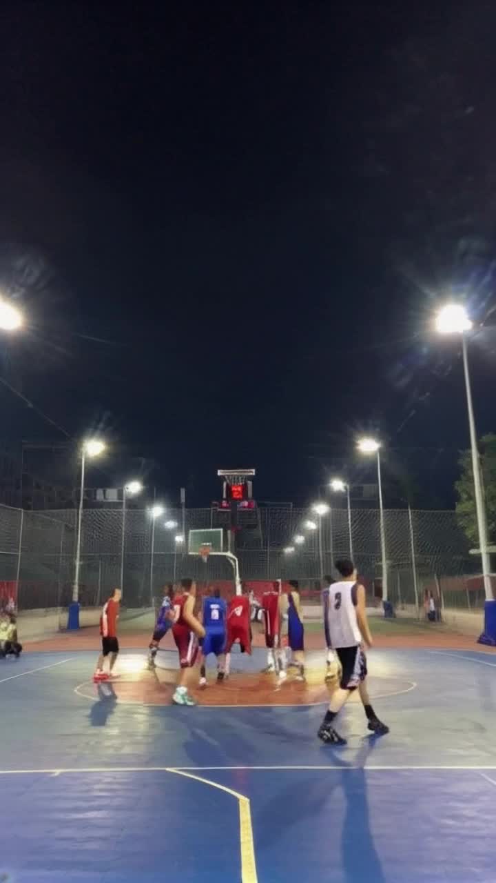 Dynamic basketball players soaring through the air Midleap with intense determination Shining gym filled with colorful jerseys bright overhead lights illuminating hardwood floor