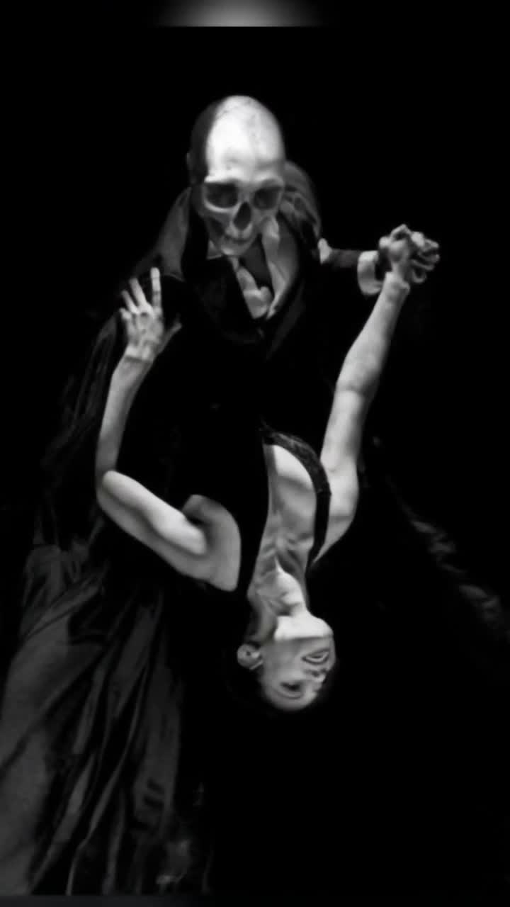 A beautiful woman, dressed in a elegant tight black dress that moves and fliws beautifully, dances with death, a skeleton dressed in a slick black suit, they tango together and he dips her back passionately as she leans, a black and white checkered tile ballroom floor beneath them, the background is a gorgeous night sky with galaxies and stars lighting up the sky, 