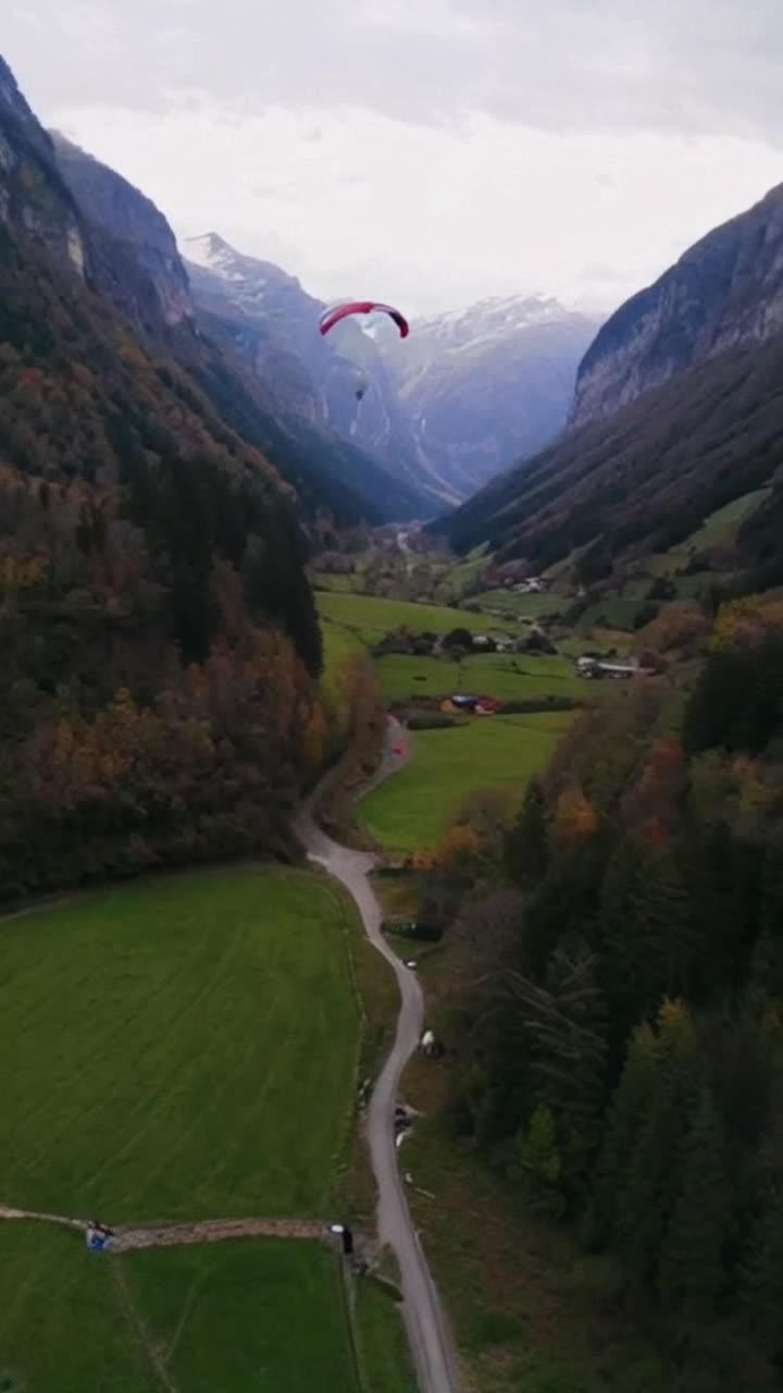 A paragliding down the valley 