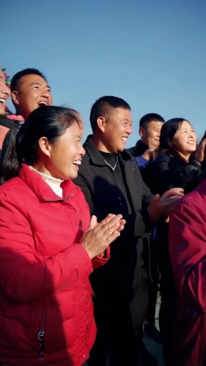 Crowd of people cheering 